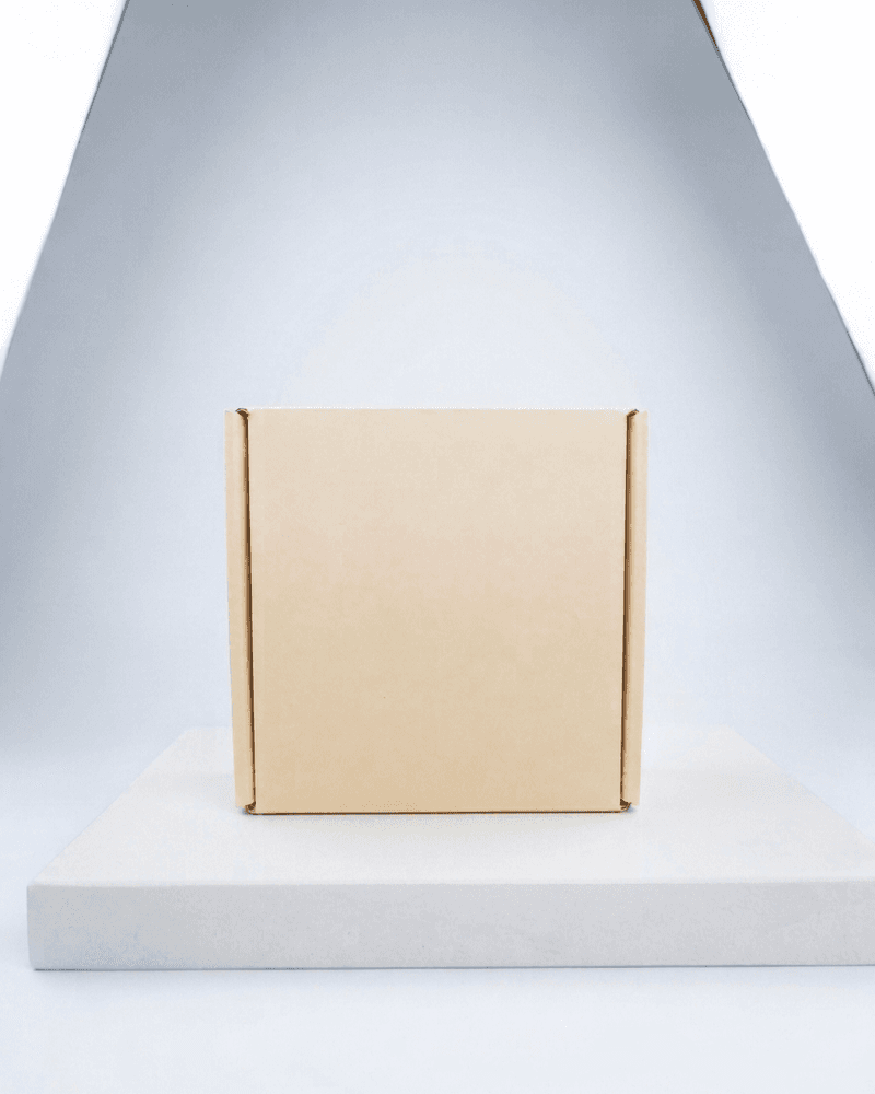 Square kraft e-commerce mailer box on pedestal